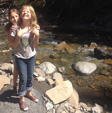 Michelle Carr's daughters standing next to Boulton Creek. 