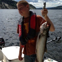 Ethan Cox showing off his catch from Williston Lake near Mackenzie. 