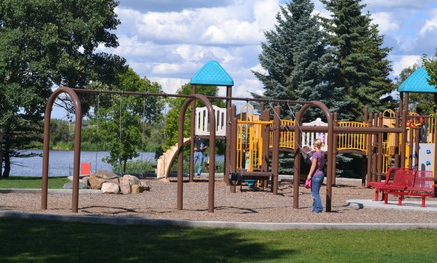 Children have fun at the playground in Fred Johns Park, Leduc, AB. Photo by 