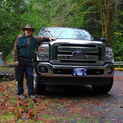 Man standing beside a truck