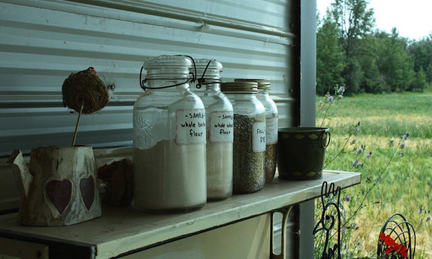 Brown Eggs and Lamb Country Store, Lacombe, AB displays locally milled flour on an outdoor shelf. 