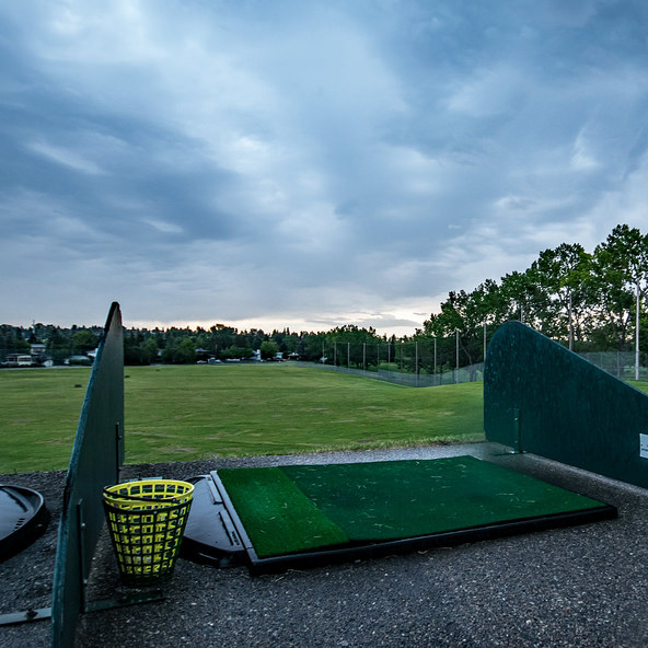 A photo of the Confederation Park Golf Course in Calgary, showing the driving range.