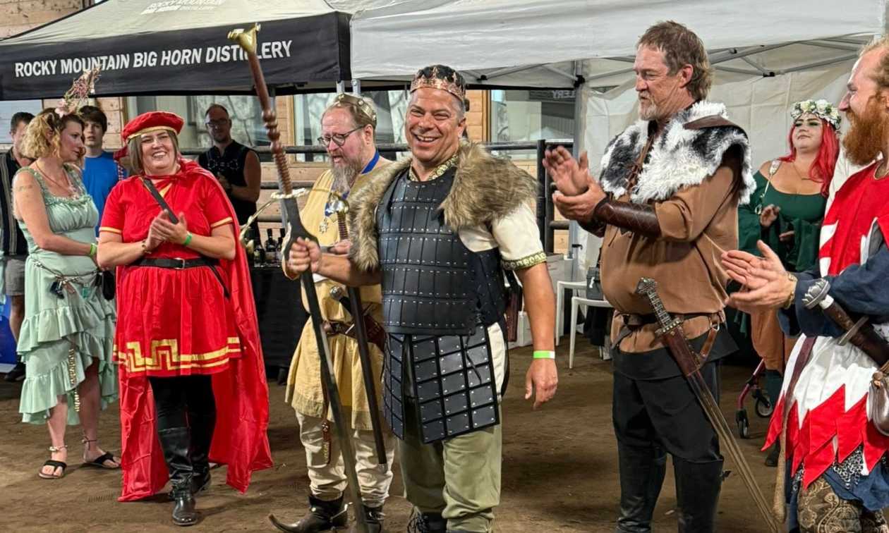 people gathered in costume at the medieval faire