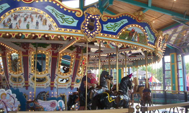 an elaborately hand-carved carousel  