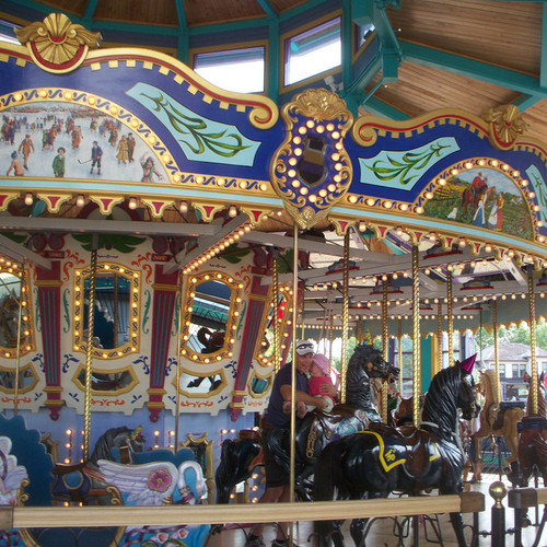 an elaborately hand-carved carousel  