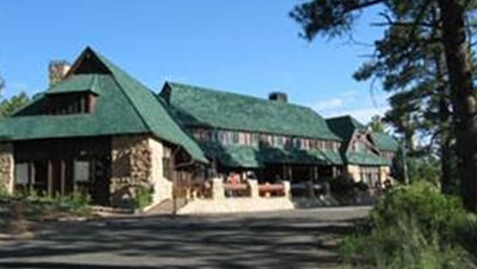 Picture of hotel with green roof. 