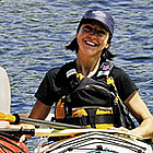 people sitting in kayaks