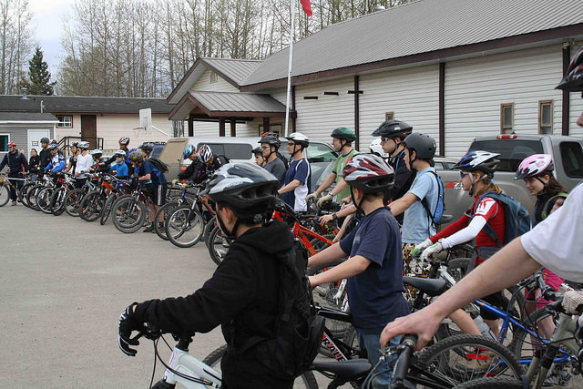 Bikers lined up to start on bike rally on the Loopee Trail system, Chetwynd, B.C.