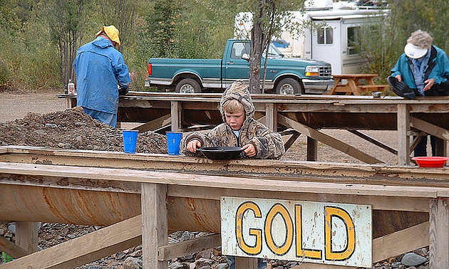 child panning for gold