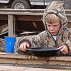 child panning for gold