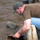 people panning for gold, and the Chicken town mascot