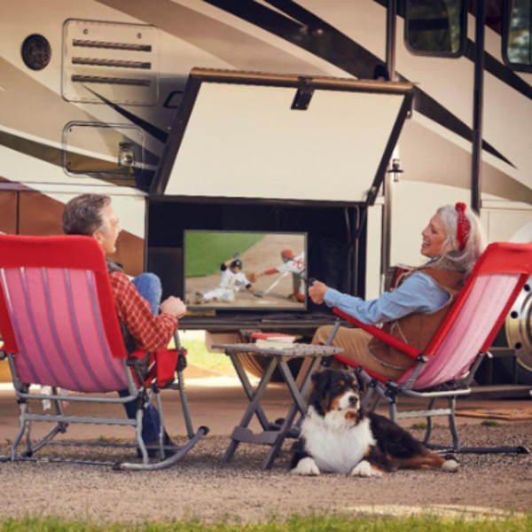 people sitting in front of their RV