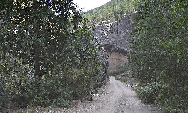 road going through a canyon area