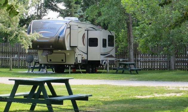 A 5th wheel parked at the Daisy May Campground and RV Resort in For Macleod, AB