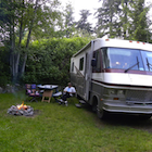 Man in a lawnchair beside a motorhome