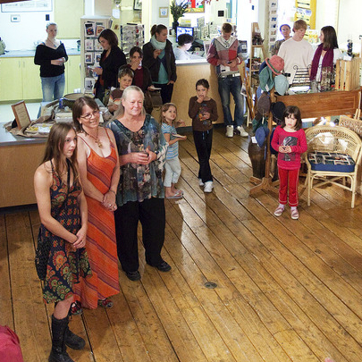 people dressed up standing in an art gallery