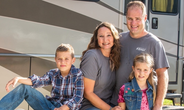 The Devries family in front of their RV