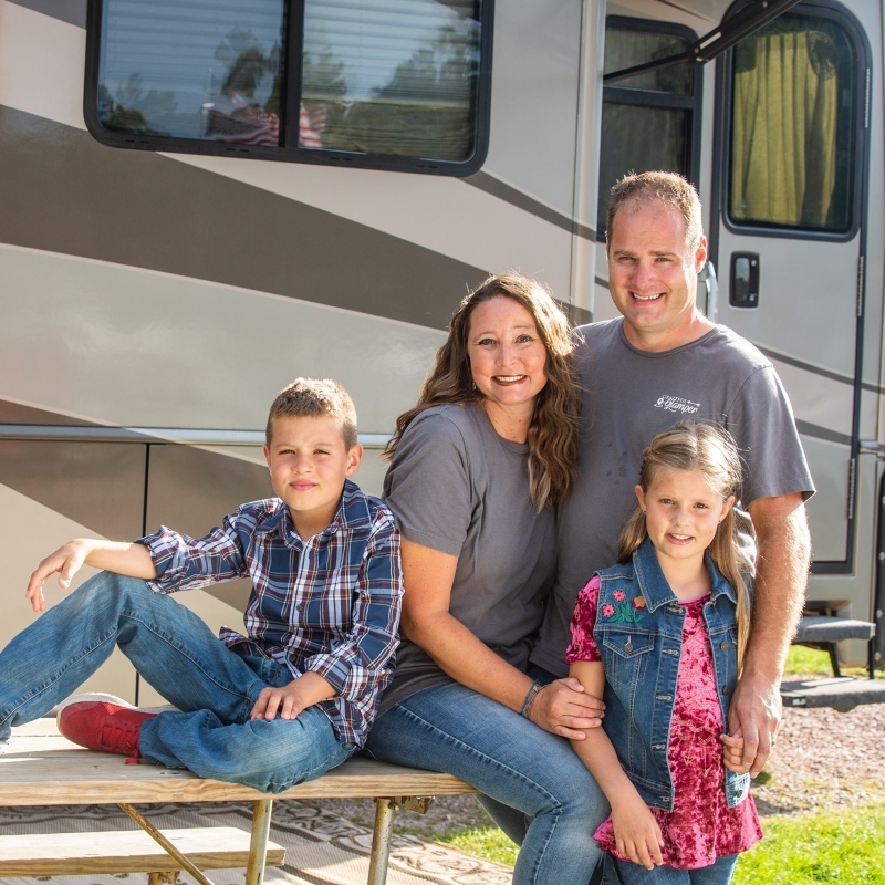 The Devries family in front of their RV