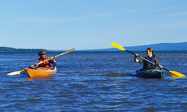 two people kayaking on an Alberta body of water