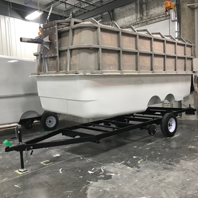 The freshly moulded fibreglass Escape Trailer shell is ready for placement on a frame.