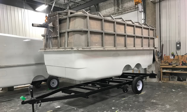 The freshly moulded fibreglass Escape Trailer shell is ready for placement on a frame. 