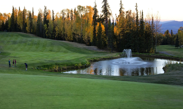 This hole on the Poplar Hills Golf & Country Club in Fort Nelson is lined with trees and has a water hazard.