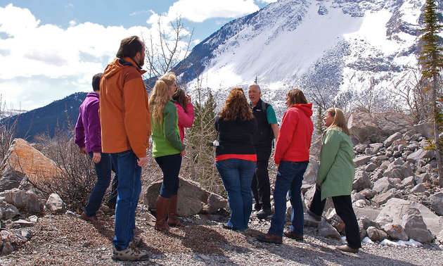 Hikers touring the Frank Slide site with a guide