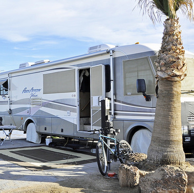 A photo of a motorhome parked on a beach in Mexico.  