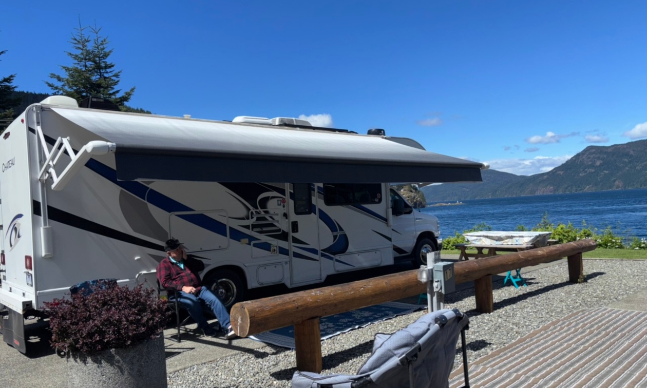 RV parked at a waterfront campsite