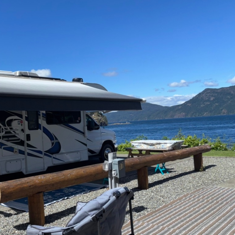 RV parked at a waterfront campsite