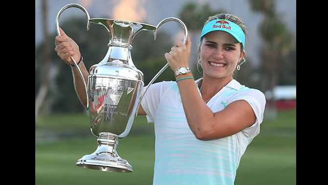 Picture of woman holding golf trophy. 