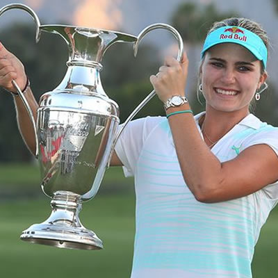 Picture of woman holding golf trophy. 