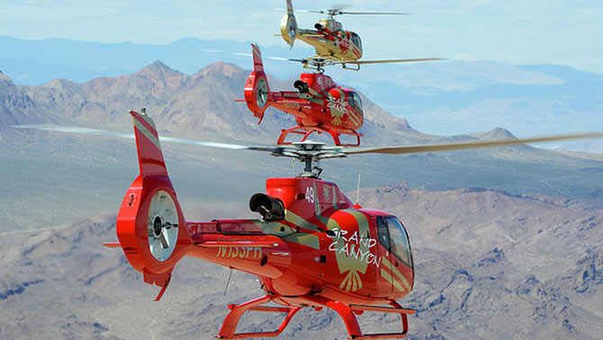 Picture of a group of helicopters over the Grand Canyon. 