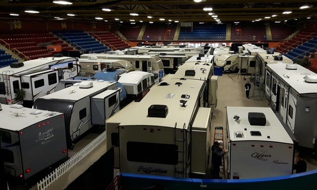 A large showroom with brand-new RVs