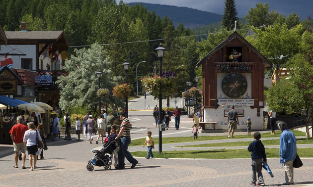 A huge cuckoo clock in Kimberley BC, with people standing around it