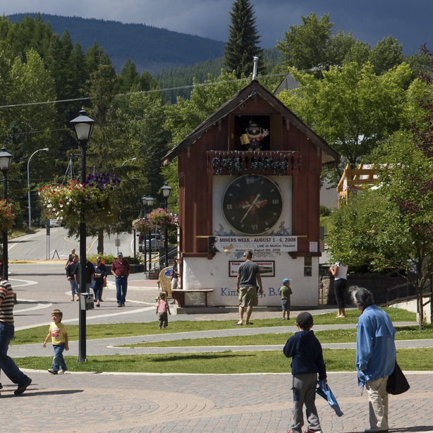 A huge cuckoo clock in Kimberley BC, with people standing around it