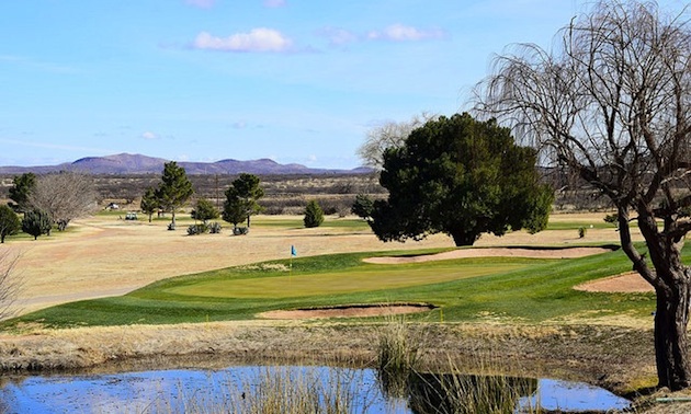 The par 3 third hole requires a shot over water.