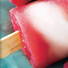 photo of a red and white ice pop. probably strawberry flavoured.