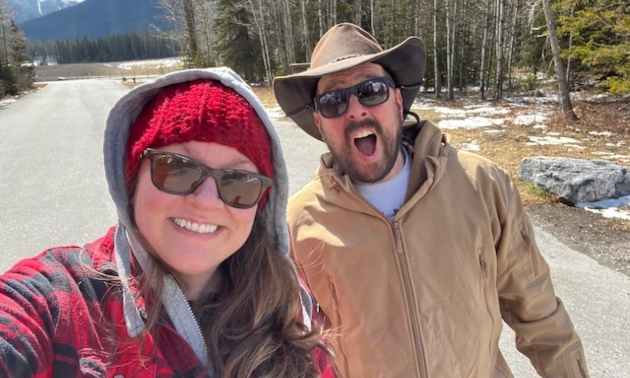 Meghan and Dan standing together and smiling at the camera