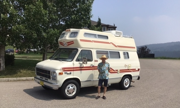 Randy Welsh standing in front of his vintage camper van