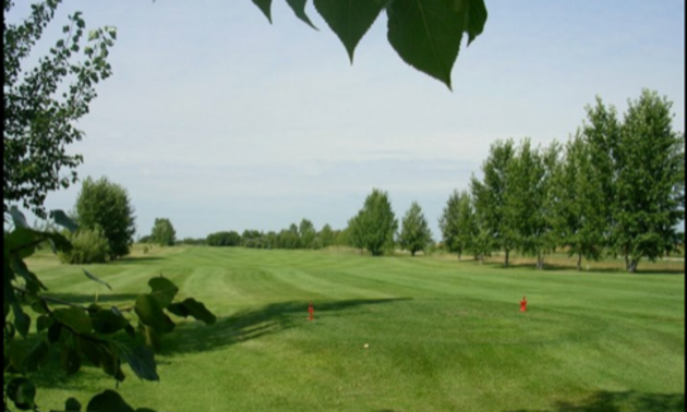 The Melville Golf & Country Club is shown with sunny skies and trees in the background.