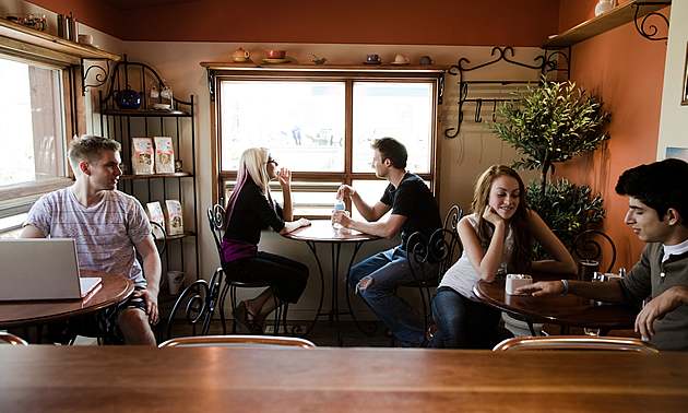 people gathered in a coffee shop