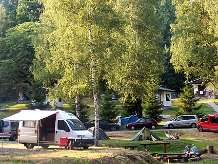 campground with RVs and people in it