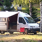 campground with RVs and people in it