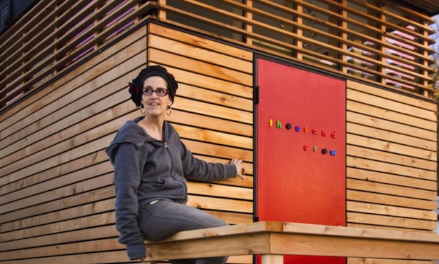 Isabella Mori on the porch of her tiny house, which she called Thousand Crows.