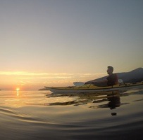 Out on the water at sunset with Bowen Island Sea Kayaking.