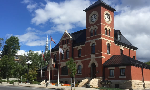 Picture of red brick building - City Hall in Kenora. 