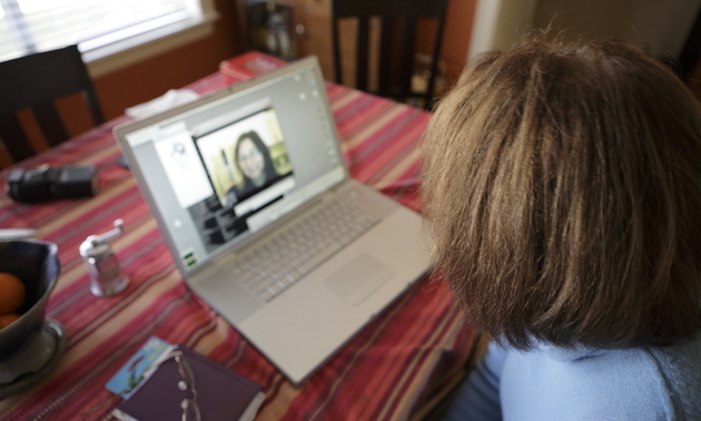 child talking on Skype to a family member