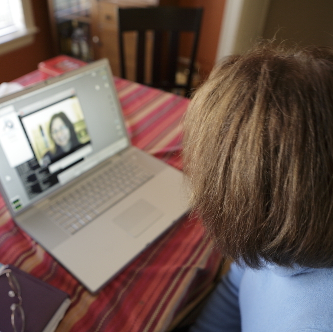 child talking on Skype to a family member