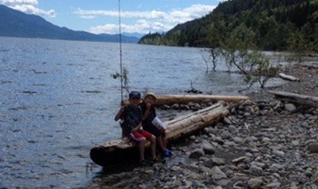 We have a 28' 2014 Springdale travel trailer, and one of our favourite places to visit is Kootenay Lake. My older son loves to fish while his younger brother loves to lend his moral support. Here they are taking a break from fishing long enough to pose for a photo.
